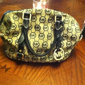 Authentic Michael Kors Bag and matching wallet