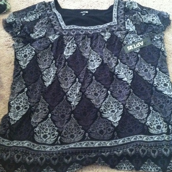 Black top with white and grey detail. Nwt