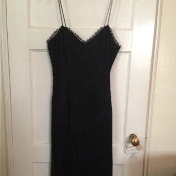 Black cocktail dress. . Bottom of dress has fringe