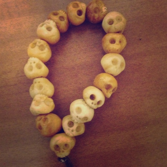 Bone carved skull bracket