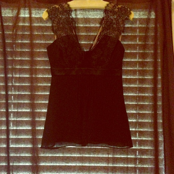 Black silk top with lace accents.