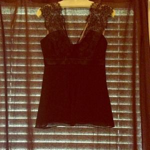 Black silk top with lace accents.