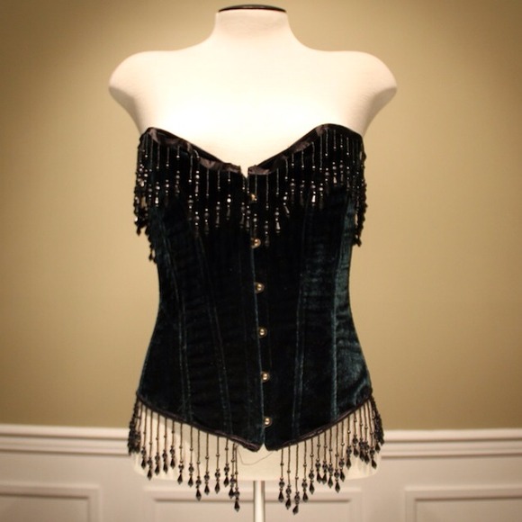 Green velvet corset with black beading.