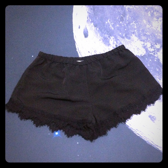 Black satin shorts.