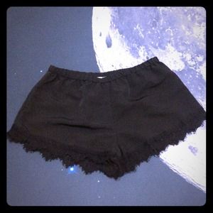 Black satin shorts.