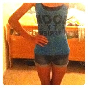 ✨✂REDUCED✂✨Blue tank top that crosses in the back.