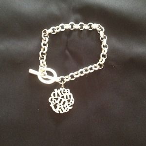 Silver toggle bracelet with "dream" charm