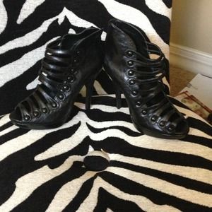 Black tall strappy heels with button detail