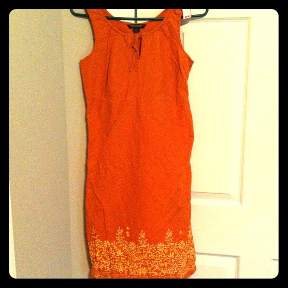 Orange dress with flower patterning and scoop neck