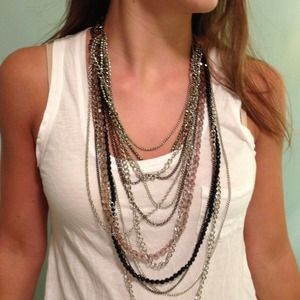 Multistrand, adjustable length necklace.