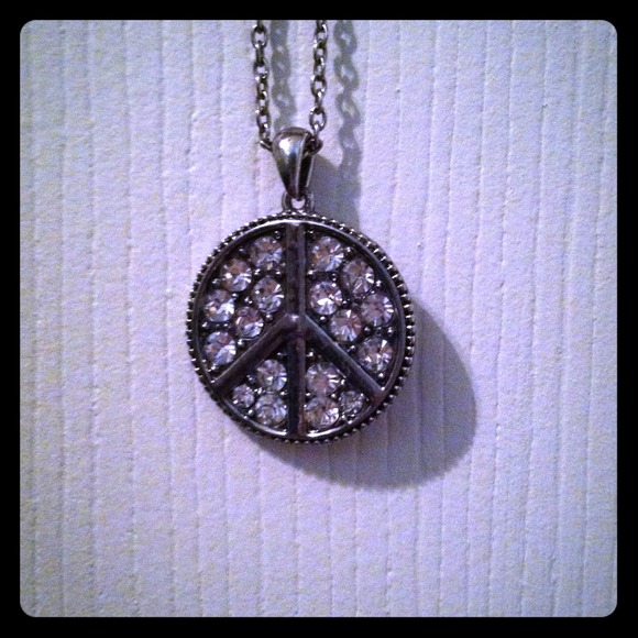 Diamond peace sign necklace.