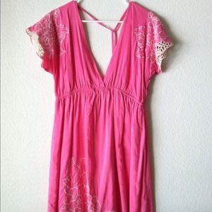 Pink dress with embroidery detail.