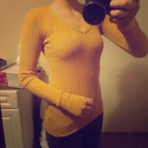 Yellow/orange long sleeve shirt. :)