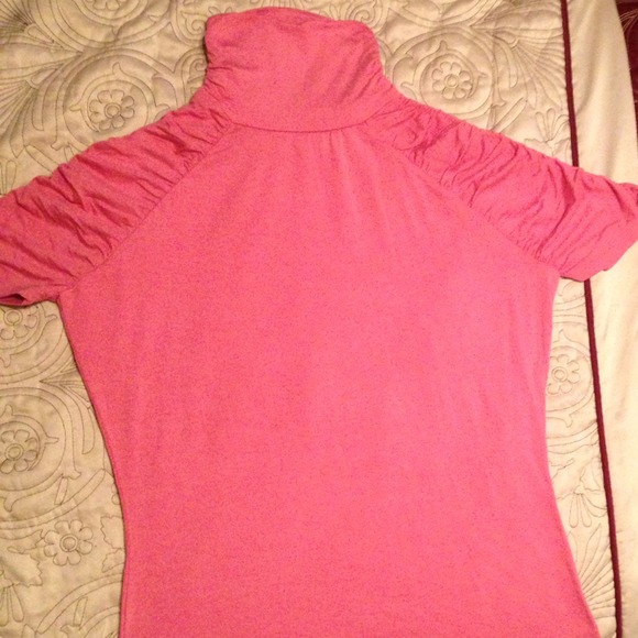 Fitted pink top.