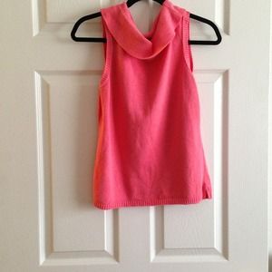 Coral sleeveless sweater blouse.