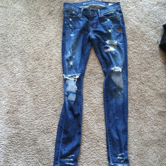 Blue ripped up boot cut jeans