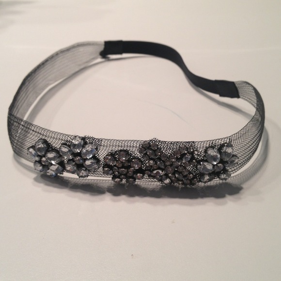 Black mesh headband with rhinestone flower design