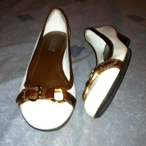 Cute white and brown flats with buckles.