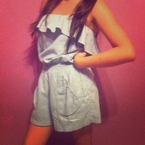 Light blue romper with ruffle on top.