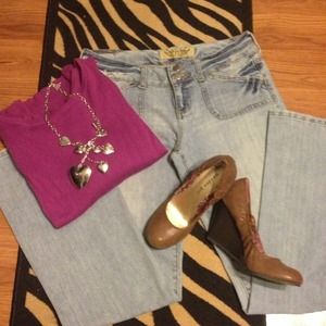 Acid washed low rise jeans with boot cut legs