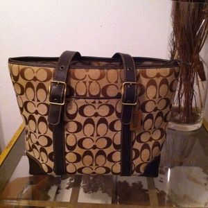 Gentle worn brown Coach signature bag.