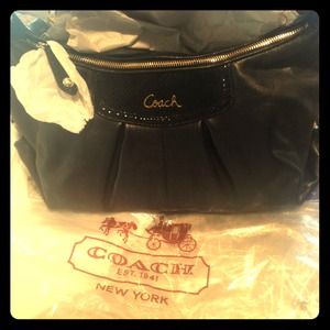 Black leather coach purse never been used