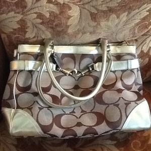 Coach purse with gold accents