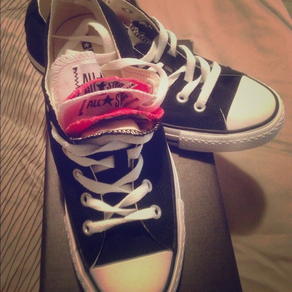 Black Converse w/ red, black, and white tongues.