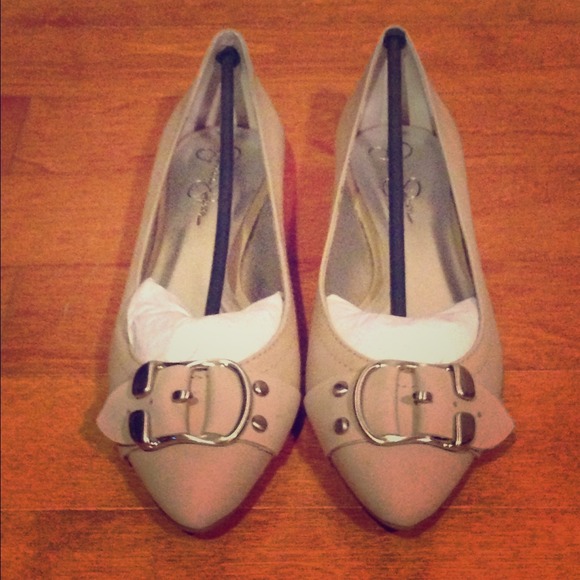Neve worn, neutral flats.