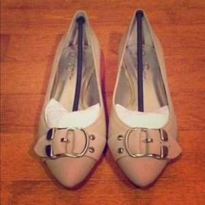 Neve worn, neutral flats.