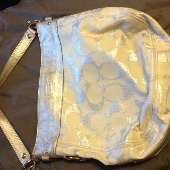 Silver and white Coach purse