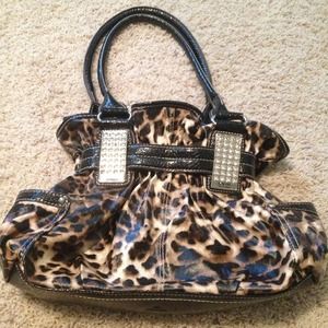 Used Kathy Van Zeeland leopard print purse