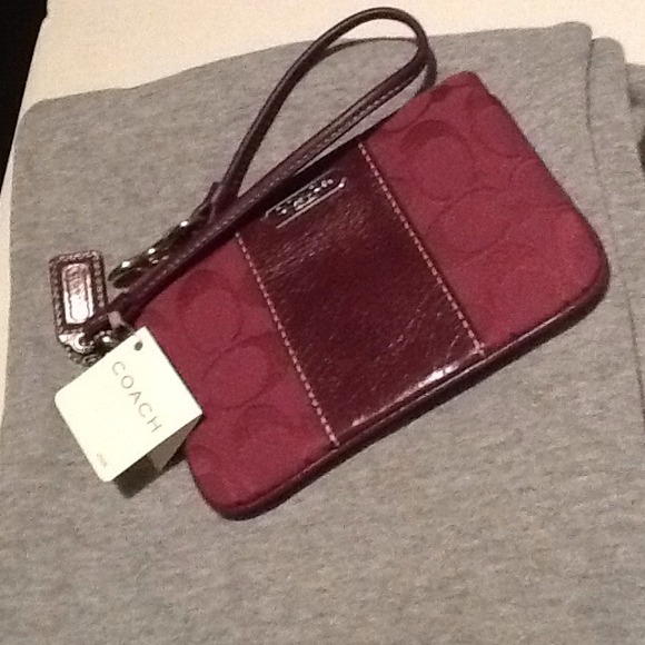 $REDUCED PRICE$NO TRADE ITEM** PLUM COACH WRISTLET