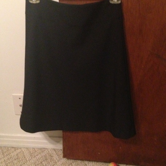 Express knee length black with blue stripes skirt.