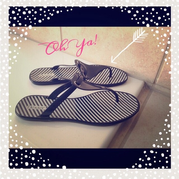 Black and white jelly sandals.