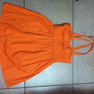 Cute orange crossed back dress.