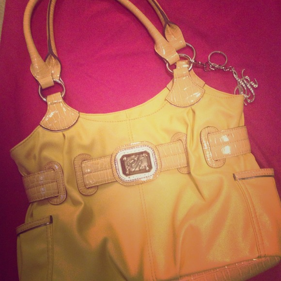 A sienna Ricchi purse in yellow.