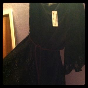 Black lace dress with brown peacock belt.