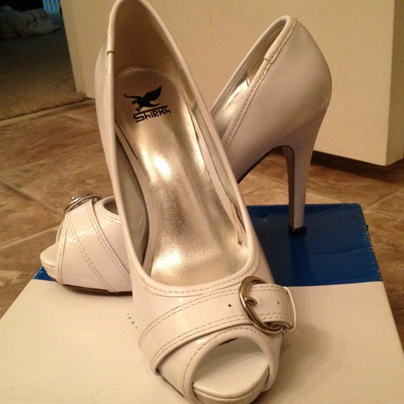 Gently used white patent Charlotte Russe heels.