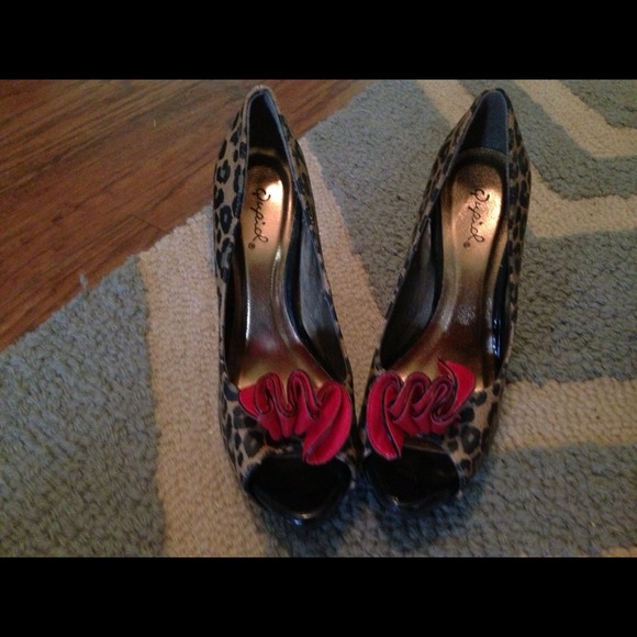 SOLD *****Animal print heels with red rosette
