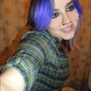 Green plaid button up with a graphic on the back.