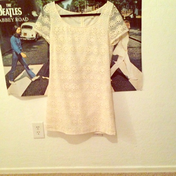 A stylish white floral dress.