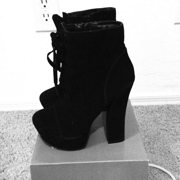 Black laced boots .