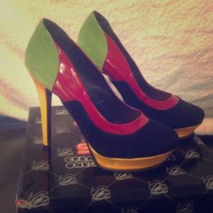 Colorful high heels red, black, green and yellow.
