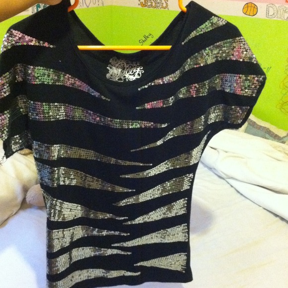 Sparkly shirt.