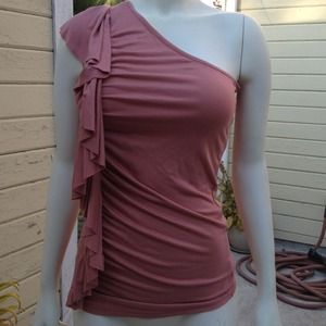 Soft pink one-shoulder top with ruffle down side
