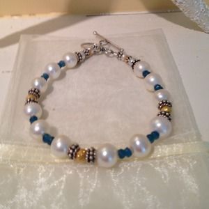 Stunning bracelet gems, pearls, gold and Silver.