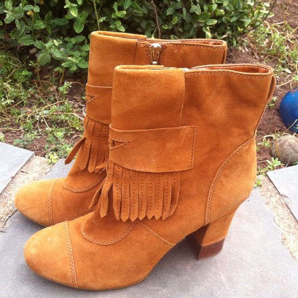 BCBGirls High Heel Boots with Fringe.