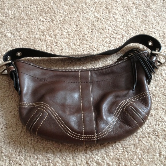 Small chocolate brown coach purse.