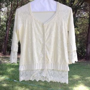 Cream top with layered lace on  sleeves bottom